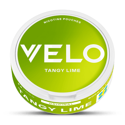 Un envase redondo de VELO Tangy Lime con tapa verde brillante, texto blanco en negrita y borde blanco. La etiqueta destaca el sabor de Tangy Lime, su origen vegetal y su fórmula original.